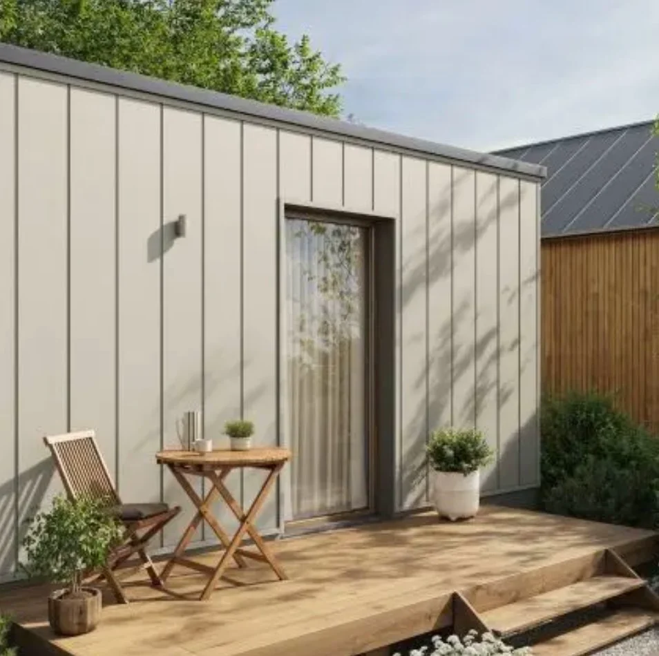 VOX grey facade cladding with a timber deck